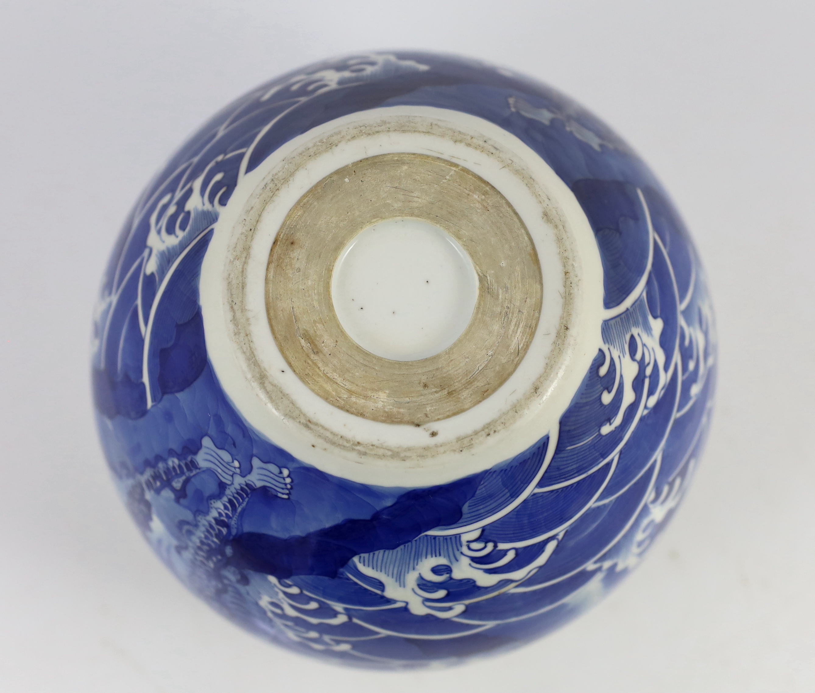 A Chinese blue and white ‘mythical beasts’ jardiniere, Kangxi period, chip and glaze losses to rim